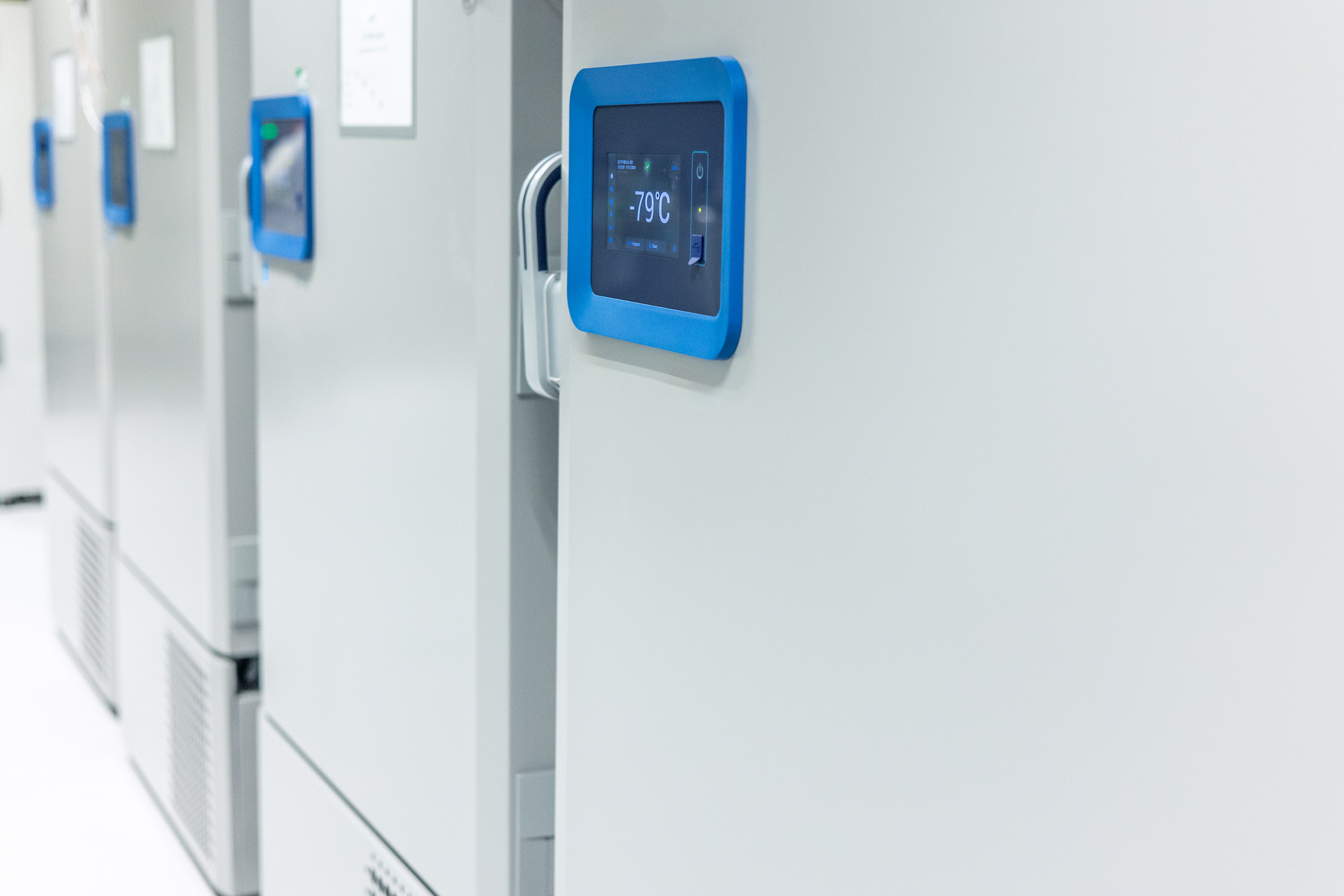 ULT freezer monitor showing -79°C, illustrating cold chain transport temperature control in a lab setting.